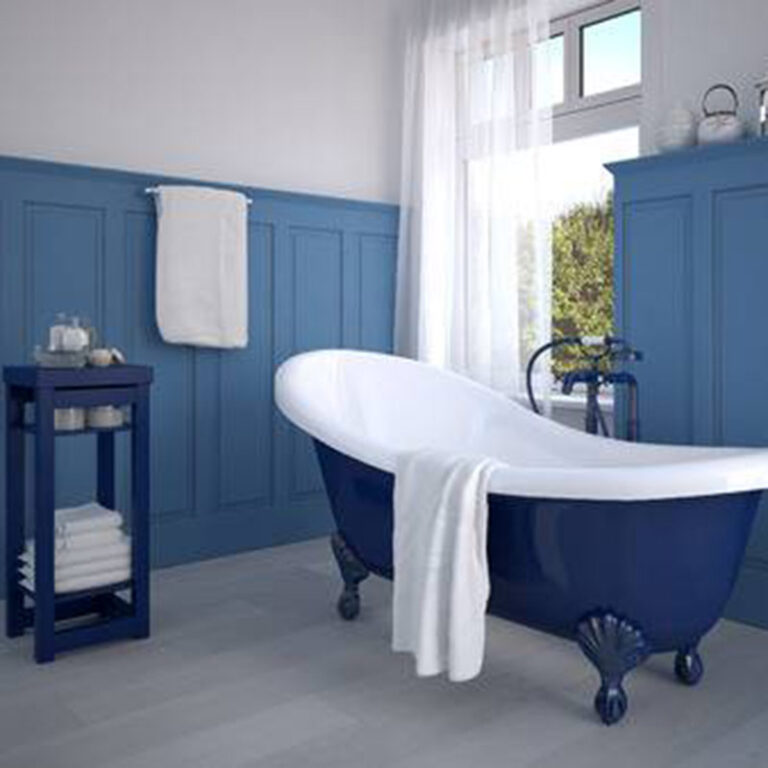 Blue wainscoting matches this blue bottom claw foot soaking tub. Great bathroom makeover ideas