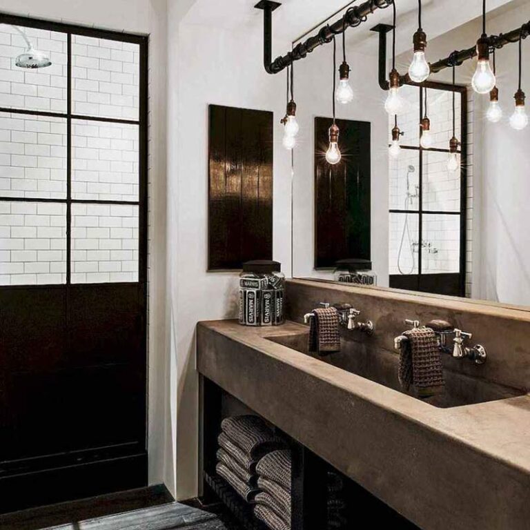 concrete bathroom vanity and sinks give this bathroom makeover an industrial look that you might expect to find in a trending Seattle home.