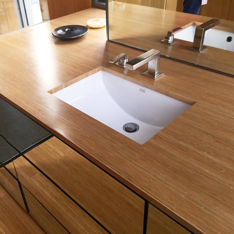 bamboo bathroom counter top and vanity give this bathroom makeover a beautiful look.